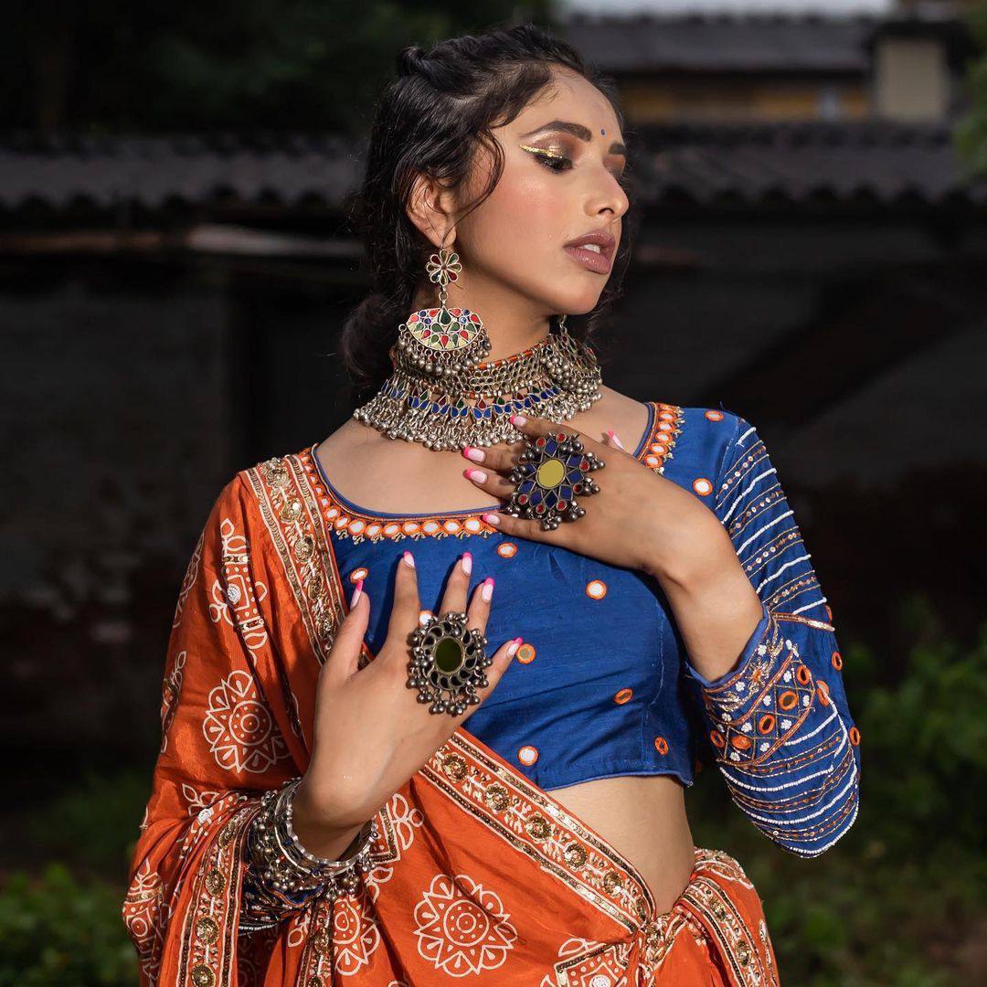 Rangrez Royalty Orange Mirror Embroidered Lehenga Choli for Navratri