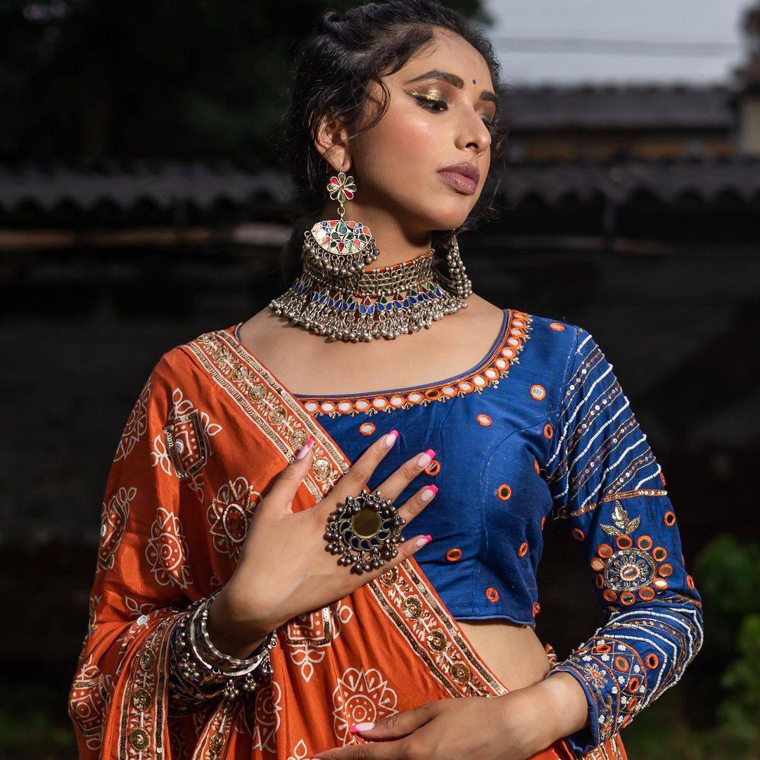 Rangrez Royalty Orange Mirror Embroidered Lehenga Choli for Navratri