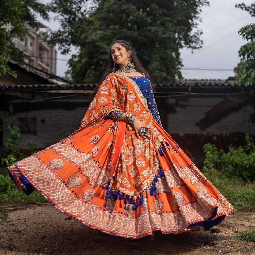 Rangrez Royalty Orange Mirror Embroidered Lehenga Choli for Navratri