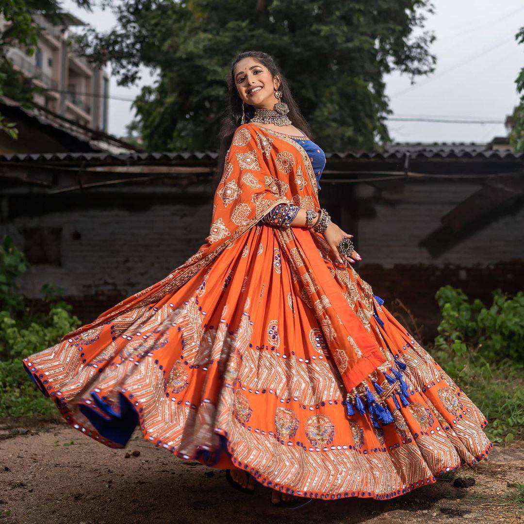 Rangrez Royalty Orange Mirror Embroidered Lehenga Choli for Navratri