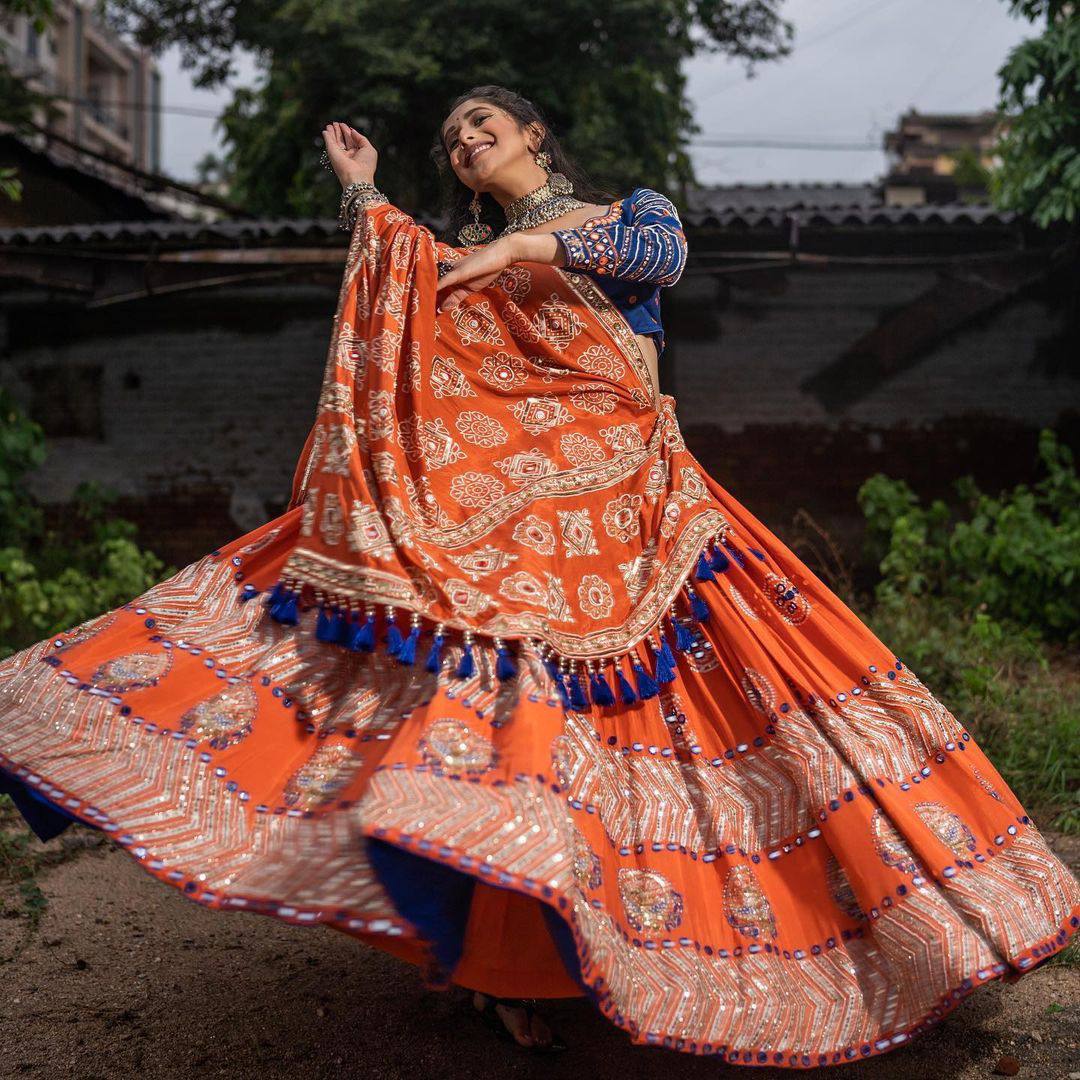 Rangrez Royalty Orange Mirror Embroidered Lehenga Choli for Navratri